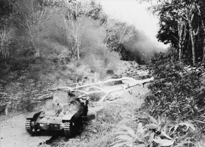 Knocked-out Japanese Type 95 Ha-Go tanks at a roadblock across the Muar - Parit Sulong road jan 42 - iwm
