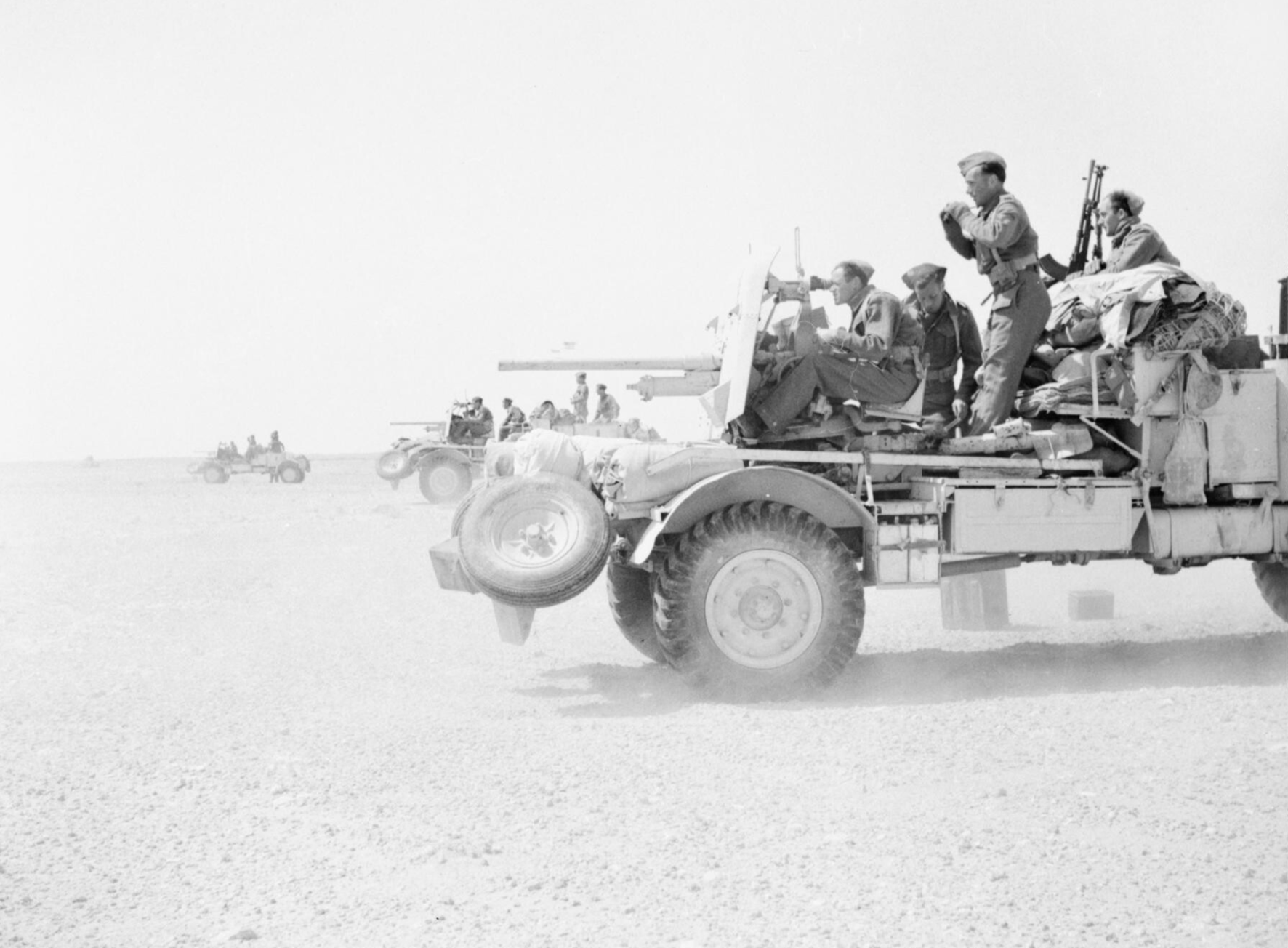 Lorry-mounted 2-pdr anti-tank guns on a practice shoot in the Western Desert, 3 May 1942 - iwm E 11223